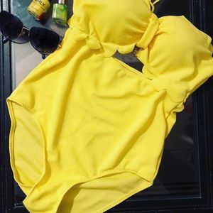 Yellow suit $10 ,bikinis $10 each , black suit $10
